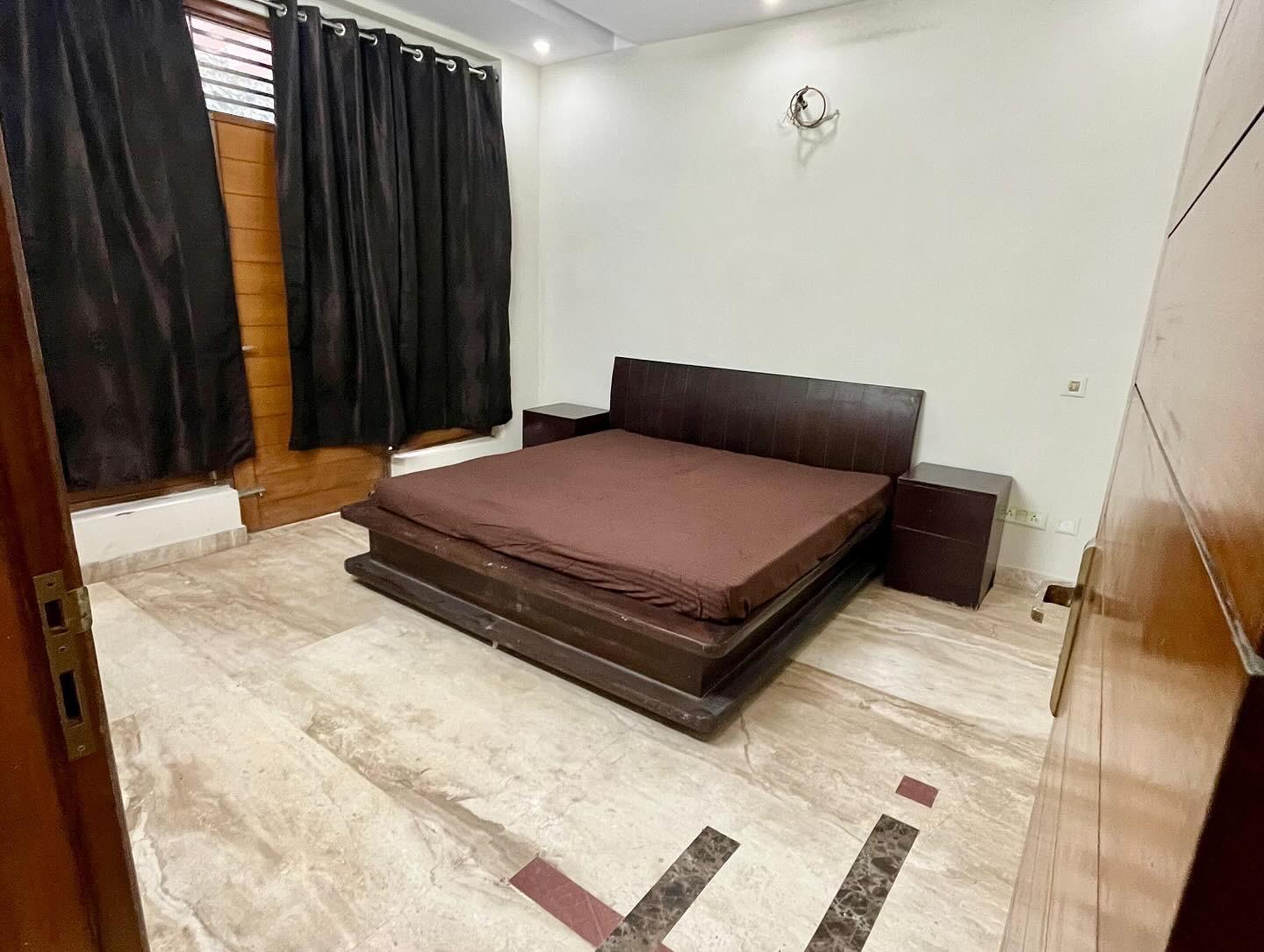 Furnished Boys PG room at GableStay in Noida